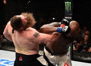 LAS VEGAS, NV - JULY 07: (R-L) Derrick Lewis connects with a right hand against Roy Nelson in their heavyweight bout during the UFC Fight Night event inside the MGM Grand Garden Arena on July 7, 2016 in Las Vegas, Nevada. (Photo by Jeff Bottari/Zuffa LLC/Zuffa LLC via Getty Images)