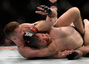 LAS VEGAS, NV - JULY 07: (L-R) Joe Duffy of Ireland secures a rear choke submission against Mitch Clarke of Canada in their lightweight bout during the UFC Fight Night event inside the MGM Grand Garden Arena on July 7, 2016 in Las Vegas, Nevada. (Photo by Brandon Magnus/Zuffa LLC/Zuffa LLC via Getty Images)