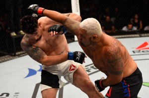 BRISBANE, AUSTRALIA - MARCH 20: (R-L) Mark Hunt of New Zealand punches Frank Mir of the United States in their heavyweight bout during the UFC Fight Night event at the Brisbane Entertainment Centre on March 20, 2016 in Brisbane, Australia. (Photo by Josh Hedges/Zuffa LLC/Zuffa LLC via Getty Images)