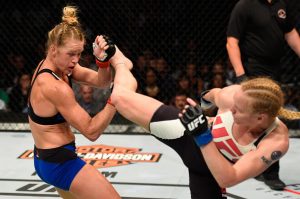 CHICAGO, IL - JULY 23: (R-L) Valentina Shevchenko of Kyrgyzstan kicks Holly Holm in their women's bantamweight bout during the UFC Fight Night event at the United Center on July 23, 2016 in Chicago, Illinois. (Photo by Josh Hedges/Zuffa LLC/Zuffa LLC via Getty Images)