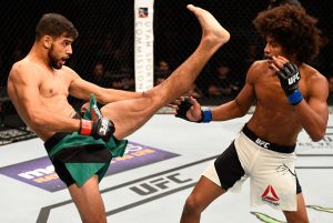 SALT LAKE CITY, UT - AUGUST 06:  (L-R) Yair Rodriguez of Mexico kicks Alex Caceres in their featherweight bout during the UFC Fight Night event at Vivint Smart Home Arena on August 6, 2016 in Salt Lake City, Utah. (Photo by Jeff Bottari/Zuffa LLC/Zuffa LLC via Getty Images)