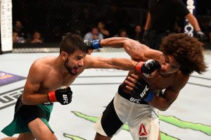 SALT LAKE CITY, UT - AUGUST 06:  (L-R) Yair Rodriguez of Mexico punches Alex Caceres in their featherweight bout during the UFC Fight Night event at Vivint Smart Home Arena on August 6, 2016 in Salt Lake City, Utah. (Photo by Jeff Bottari/Zuffa LLC/Zuffa LLC via Getty Images)